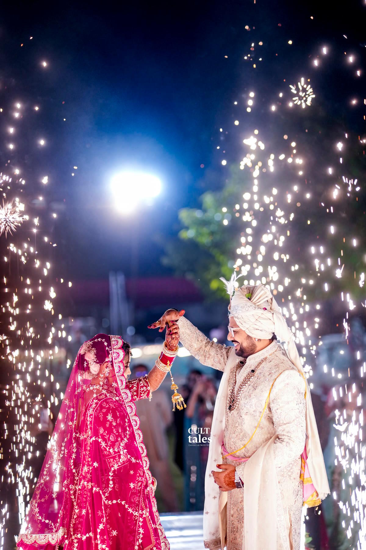 The couple dancing in a shower of sparks